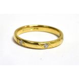 A HALLMARKED 18CT GOLD DIAMOND SET WEDDING BAND The D profile band 3mm wide bead set with three
