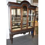 MAHOGANY DISPLAY CABINET, with the cornice having a molded floral surround, above a glazed front