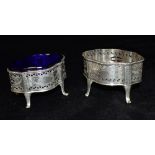 A PAIR OF VICTORIAN SILVER SALTS by Goldsmiths and Silversmiths Company, the oval salts on four