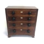 AN APPRENTICE PIECE CHEST OF FOUR LONG GRADUATING DRAWERS, raised on bracket feet, 37cm x 30.5cm x