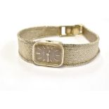 A LADIES VINTAGE OMEGA 9CT WHITE GOLD BRACELET WATCH The rectangular slate grey dial to integral,