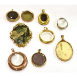 EIGHT LOCKETS AND A BROOCH The locket to include a large oval stamped 9ct locket; five 19th