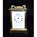 A FRENCH BRASS CASED CARRIAGE CLOCK the enamelled dial with Roman numerals, the 8-day movement