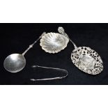 THREE ITEMS OF SILVERWARE Comprising a small shell dish, 1905 Sheffield, a shallow round skimming