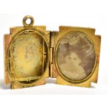 A VICTORIAN LOCKET the rectangular locket with raised front, monogrammed initials, assessed as