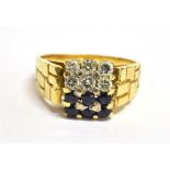 A DIAMOND AND SAPPHIRE SQUARE CLUSTER 18CT GOLD RING the square head set with six small round