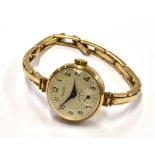 A LADIES VINTAGE AUDAX WRIST WATCH On a 9ct gold expanding bracelet, gross weight 15.8 grams,
