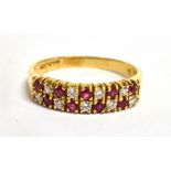A RUBY AND DIAMOND TWO ROW 18CT GOLD HALF ETERNITY RING The front section comprising two rows of