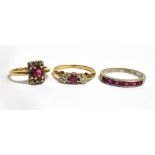 THREE RUBY SET 9CT GOLD RINGS comprising a ruby and small diamond rectangular cluster, a ruby and