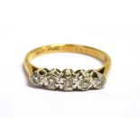 A DIAMOND FIVE STONE 18CT GOLD RING The five small illusion set eight cut diamonds 0.16 carat total,