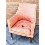 MAHOGANY ARMCHAIR, with floral upholstery and raised on casters, 100cm high Condition Report : One