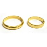 TWO 18CT GOLD PLAIN WEDDING BANDS the larger of D profile, 4mm wide, size T, the smaller with