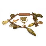 A SMALL 9CT GOLD ID/CHARM BRACELET The bracelet containing four small 9ct gold charms and one