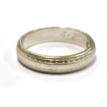 A LADIES PLATINUM WEDDING BAND With patterned beaded border, 4mm wide, size J, weighing approx. 4.