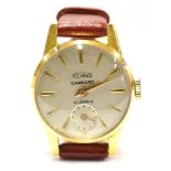 A LADIES VINTAGE 18CT GOLD GARRARD WRIST WATCH The round steel dial with subsidiary seconds dial, to