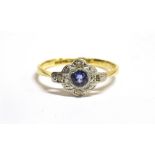 AN ART DECO SMALL SAPPHIRE AND DIAMOND SET CLUSTER RING The small central round cut sapphire with