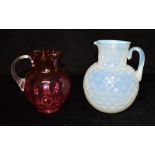 A VICTORIAN BLUE VASELINE GLASS JUG 19.5cm high and cranberry coloured glass jug 16cm high (2)