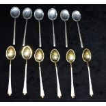 TWO SETS OF SIX COFFEE SPOONS One silver gilt and enamelled set stamped Denmark sterling, the