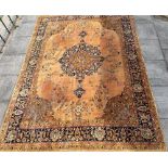 A LARGE CARPET with central medallion and foliate designs within a palmette border, 270cm x 370cm