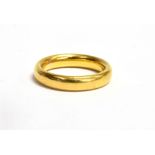 A 22CT GOLD PLAIN WEDDING BAND Of court profile, 4 mm wide, size N, gross weight approx. 8.3 grams