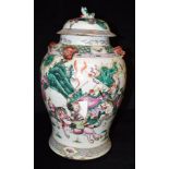 A LARGE CHINESE BALUSTER SHAPED VASE AND COVER decorated in the Famille Verte palette with a
