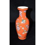 A CHINESE REPUBLIC PERIOD VASE decorated with scholars objects on a red ground, seal type mark to