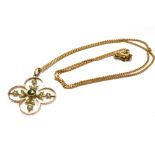 AN EDWARDIAN 9CT GOLD PERIDOT AND SEED PEARL PENDANT On a later 9ct gold chain, the four leaf clover