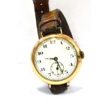 A 9CT GOLD VINTAGE WRIST WATCH The round white enamelled dial with subsidiary seconds dial, 35mm