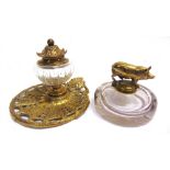 TWO INKWELLS the first of cast brass, with a glass reservoir, the base marked 'TOWNSHEND & CO' and