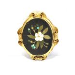 A VICTORIAN PIETRA DURA OVAL BROOCH The yellow metal bezel mount surround and scroll border