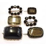 SIX ITEMS OF LATE GEORGIAN/VICTORIAN MOURNING JEWELLERY The black stone set and enamel small