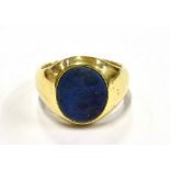 A GENT'S HALLMARKED 18CT GOLD LAPIS LAZULI SET SIGNET RING The oval tablet of Lapis Lazuli 15mm