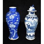 A CHINESE BALUSTER SHAPED VASE with underglaze blue painted decoration of a procession of