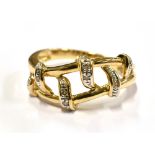 A 9CT GOLD DRESS RING The openwork front set with four very small diamonds, size J ½, gross weight