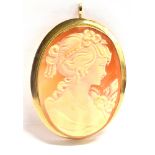 A 9CT GOLD OVAL CAMEO PENDANT/BROOCH The oval shell cameo of a modern young lady in 9ct gold bezel