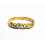 A DIAMOND FIVE STONE 18CT GOLD RING the boat shaped head claw set with five graduating small old