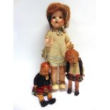 THREE ASSORTED DOLLS comprising a Pedigree hard plastic doll with a walking mechanism, 53cm high;