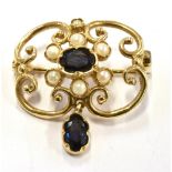 A MODERN SAPPHIRE AND CULTURED PEARL 9CT GOLD PENDANT BROOCH The open scroll design of quatrefoil