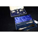 TWO BOXED ITEMS OF SILVERWARE Comprising a three piece condiment set, approx. 108 grams, 1923 and