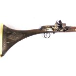 A MIDDLE EASTERN FLINTLOCK RIFLE 19th century, the 129cm steel barrel with engraved brass bands, the