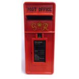A CAST METAL POST OFFICE LETTER BOX painted red, the door marked 'G VI R' and with raised