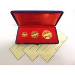 AN 18CT GOLD BATTLE OF BRITAIN COMMEMORATIVE MEDAL SET comprising three medals, each numbered and
