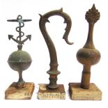 THREE WEST COUNTRY FRIENDLY SOCIETY BRASS POLE HEADS comprising one with an anchor atop an orb,