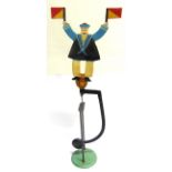 A PAINTED METAL BALANCE TOY in the form of a sailor with semaphore signal flags, overall 58cm high.