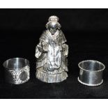 A VICTORIAN NOVELTY WEIGHTED SILVER COATED FIGURAL TABLE BELL with nodding head, modelled in the