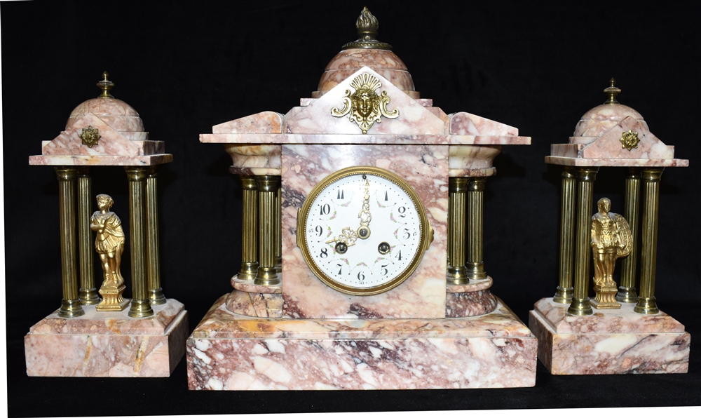 A VICTORIAN MARBLE CLOCK GARNITURE the enamel dial with Arabic numerals and floral decoration,