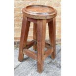 A TEAK TABLE, the circular top having a moulded raised edge, 40cm diameter, and raise on four square