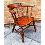 A SMOKER'S BOW CHAIR with elm seat, H 74cm high