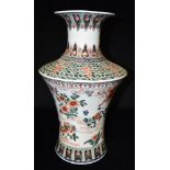 A LARGE CHINESE PORCELAIN VASE the shoulders decorated with figures on a stylised wave background,