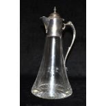 A HEAVY GLASS CLARET JUG with silver handles and silver top, hallmarked for Sheffield 2003